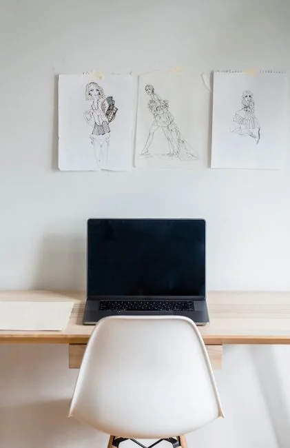 A polished office desk arrangement showcasing Apple devices: iMac, MacBook, and iPad.
