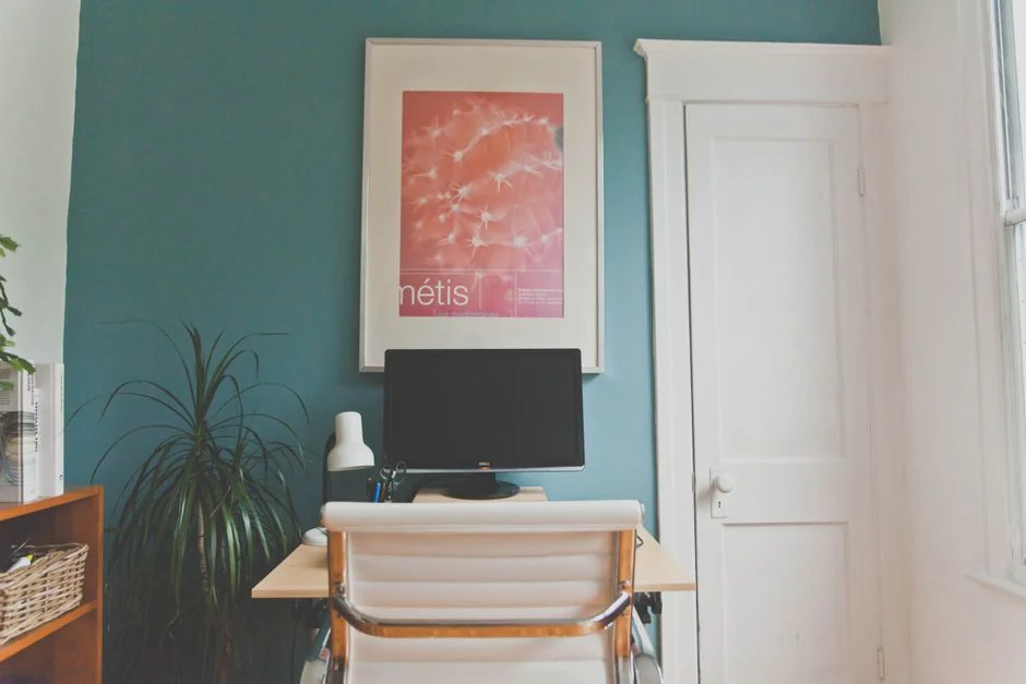 Stylish and efficient workspace with multiple monitors, laptop, and smartphone, showcasing a web design project.